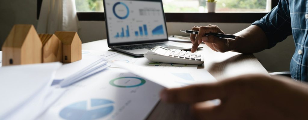 Business Financing Accounting Banking Concept, businessman doing finances and calculate about cost